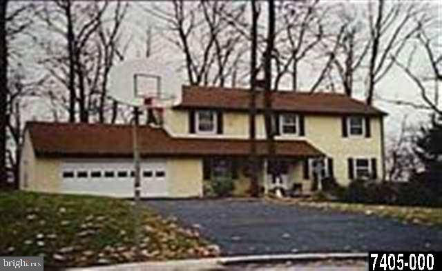 5042 Rislyn Court Spring Grove, PA 17362 - Photo 1 of 15 a view of a white house with large windows and a tree