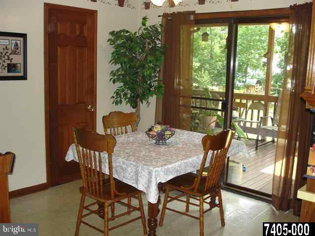 5042 Rislyn Court Spring Grove, PA 17362 - Photo 4 of 15 a view of a dining room with furniture window and wooden floor
