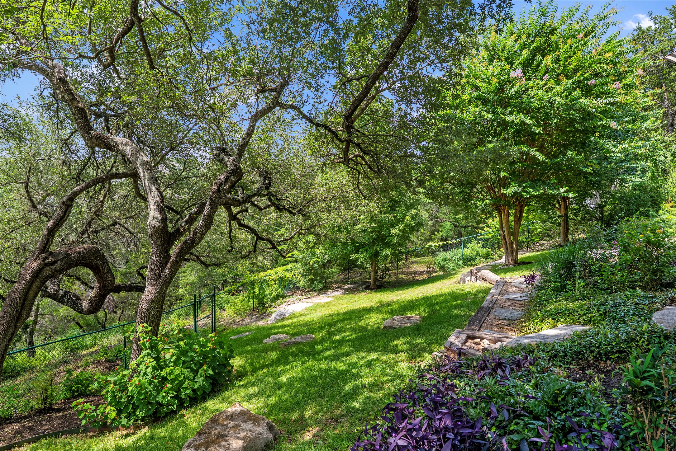 3107 Lookout Lane Austin, TX 78746 - Photo 37 of 39 Beyond the pool lies a secluded landscape with mature trees leading to greenbelt trails and secret garden.