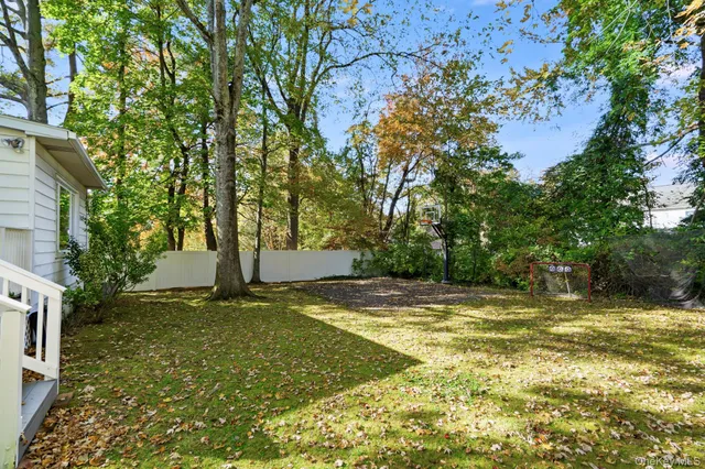 a view of a yard with a tree