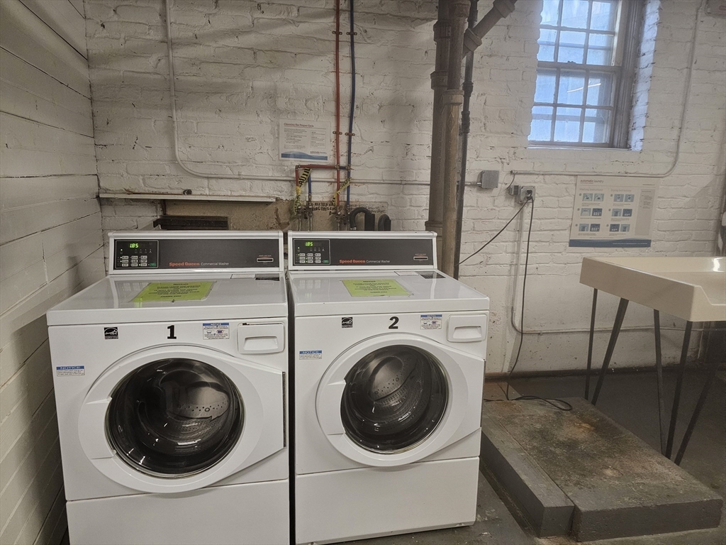 60 Elm Street, Unit 2A Worcester, MA 01609 - Photo 11 of 13 a utility room with dryer and washer