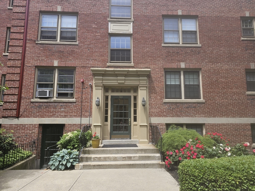 60 Elm Street, Unit 2A Worcester, MA 01609 - Photo 2 of 13 a front view of a house with a garden