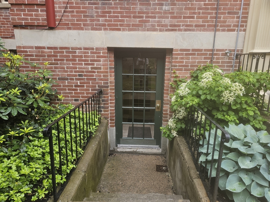 60 Elm Street, Unit 2A Worcester, MA 01609 - Photo 3 of 13 a front view of a house with a garden