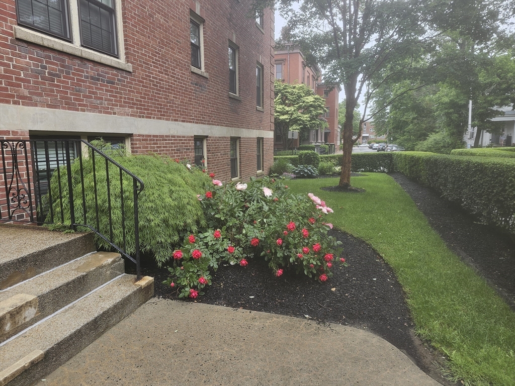 60 Elm Street, Unit 2A Worcester, MA 01609 - Photo 4 of 13 a view of a house with a yard and garden
