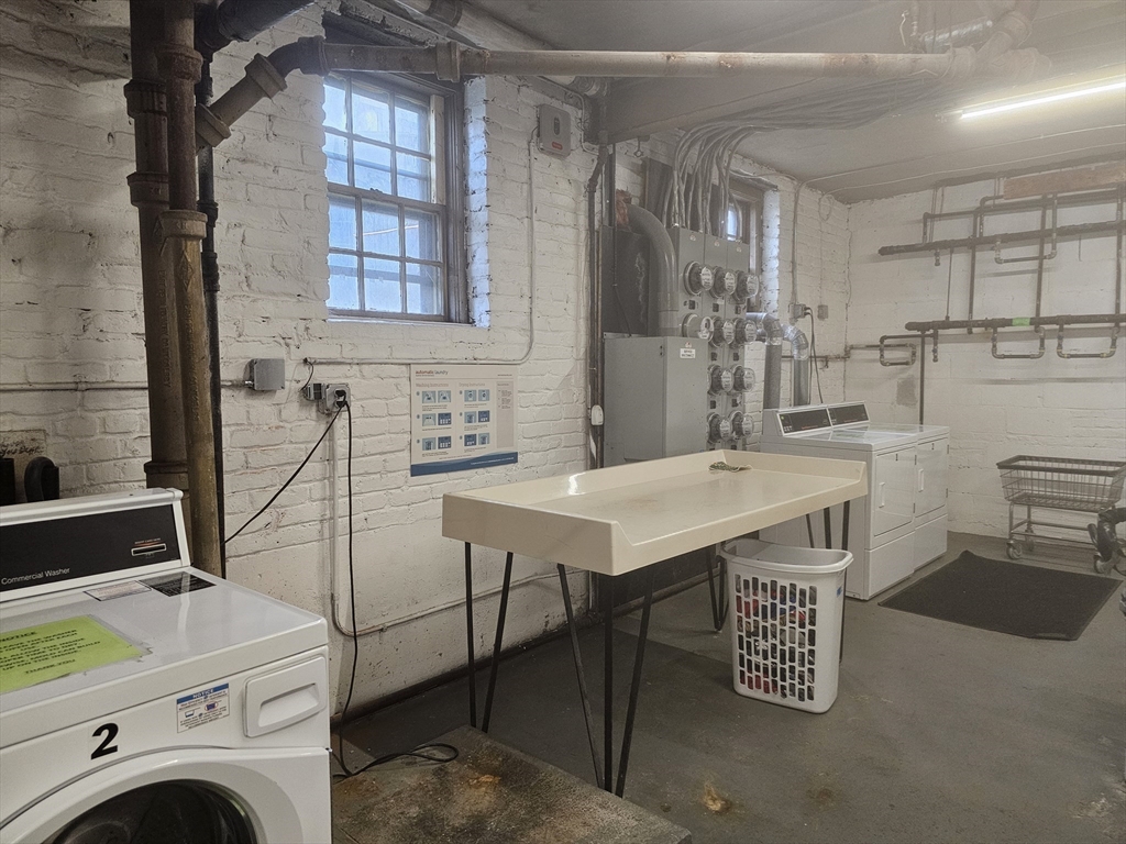 60 Elm Street, Unit 2A Worcester, MA 01609 - Photo 10 of 13 a utility room with multiple dryer and washer