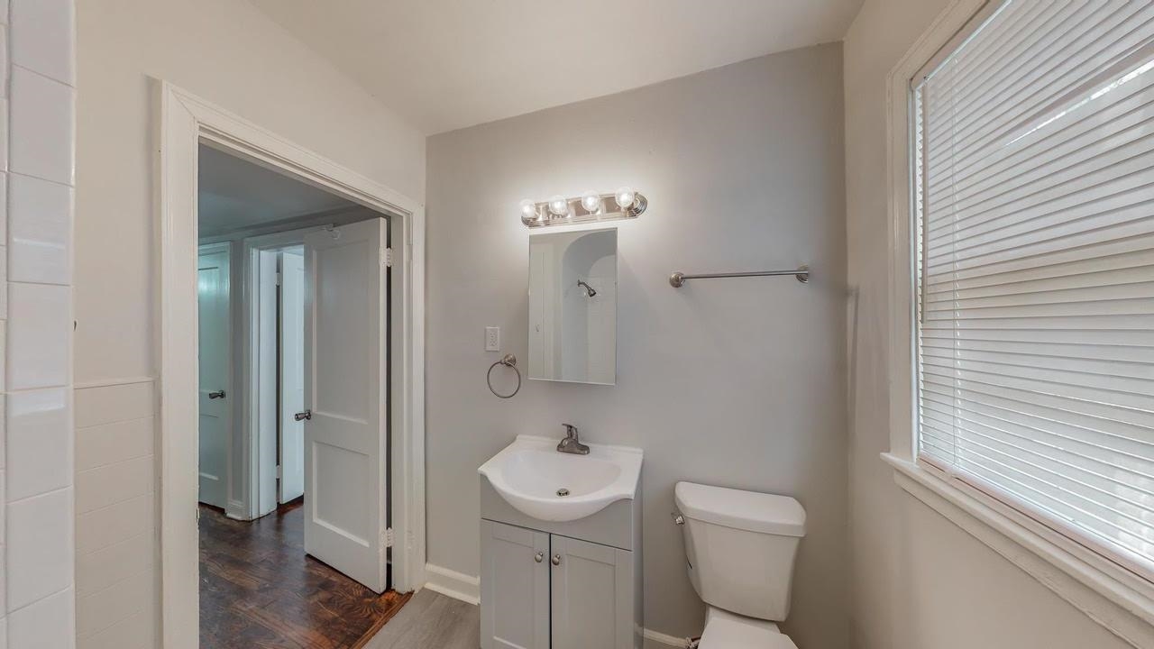 3393 Carrington Road Memphis, TN 38111 - Photo 6 of 11 Bathroom with vanity and dark wood finished floors