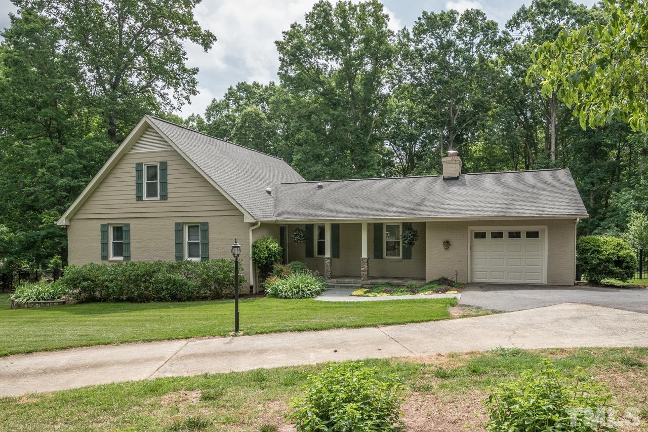 2505 Countrywood Road Raleigh, NC 27615 - Photo 1 of 36 a house with green field in front of it