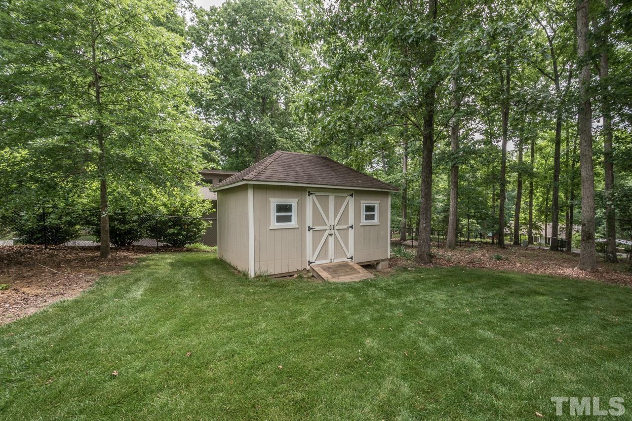 2505 Countrywood Road Raleigh, NC 27615 - Photo 18 of 36 a view of a house with a yard