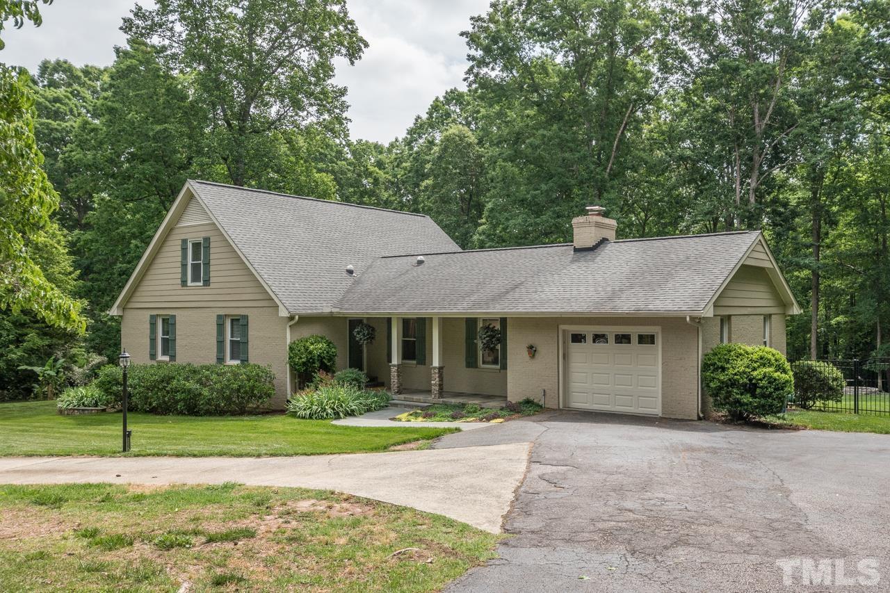 2505 Countrywood Road Raleigh, NC 27615 - Photo 36 of 36 a front view of a house with a garden