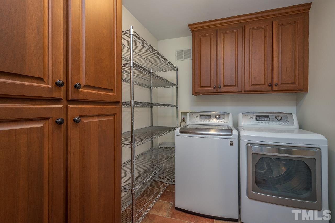2505 Countrywood Road Raleigh, NC 27615 - Photo 9 of 36 a utility room with dryer and washer