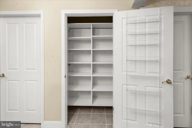 a bathroom with a sink mirror and toilet