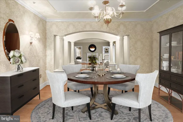 a view of a dining room with furniture and chandelier
