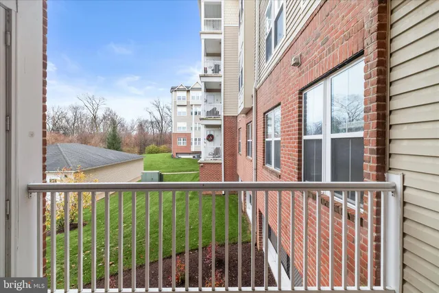 a view of a backyard with sitting area