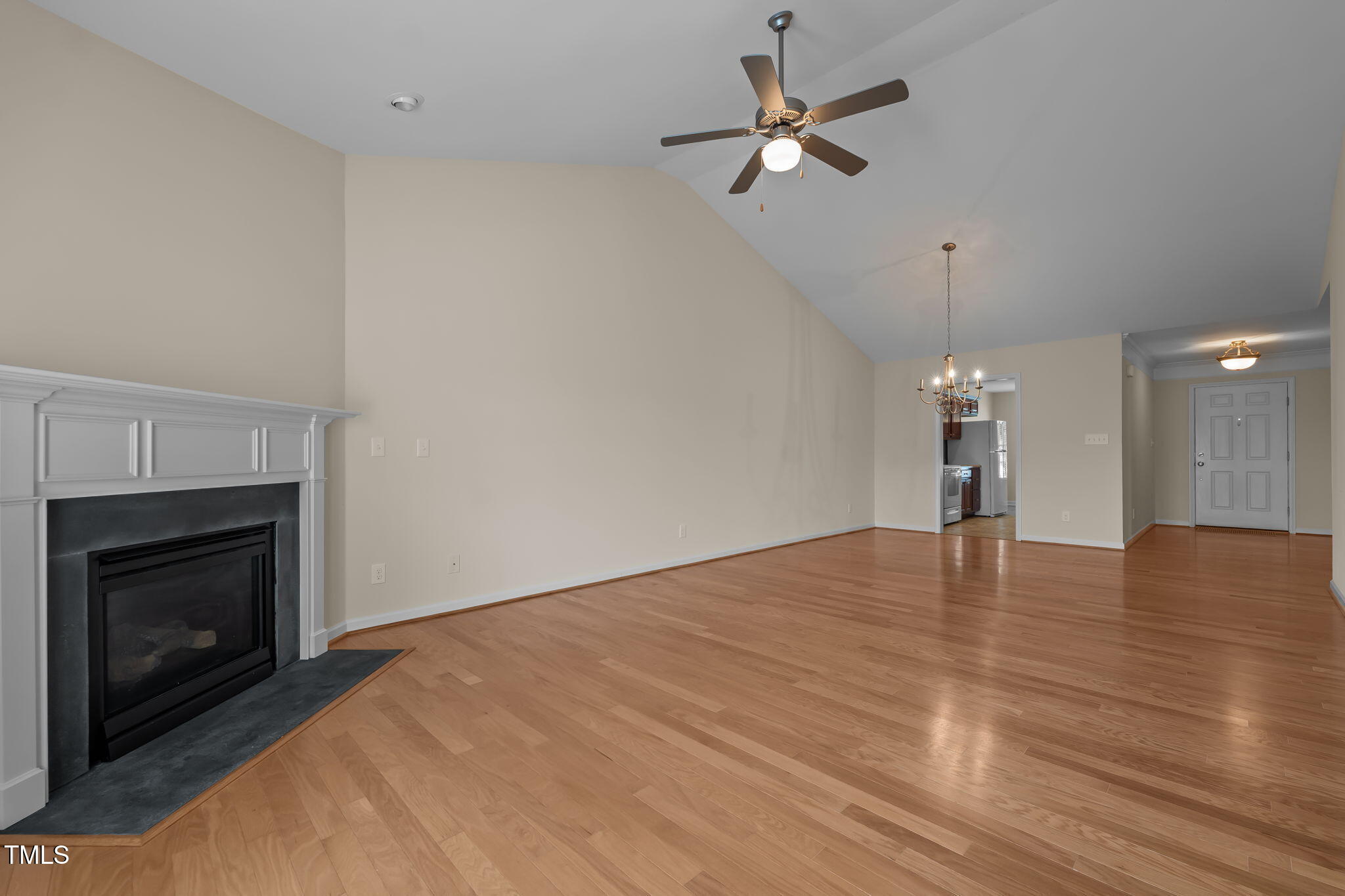 2002 Guinness Drive, Unit 5 Graham, NC 27253 - Photo 11 of 30 a view of empty room with wooden floor and fireplace