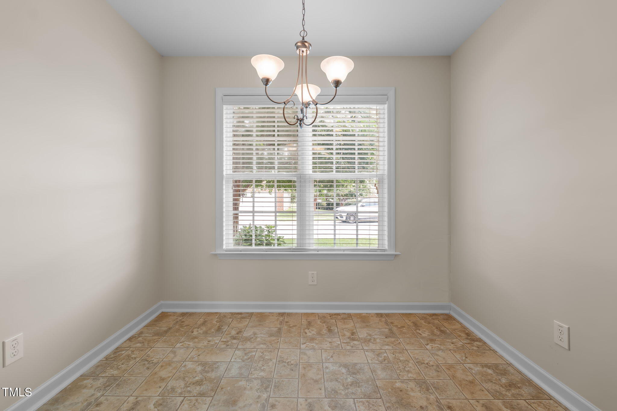 2002 Guinness Drive, Unit 5 Graham, NC 27253 - Photo 16 of 30 a view of an empty room with a window