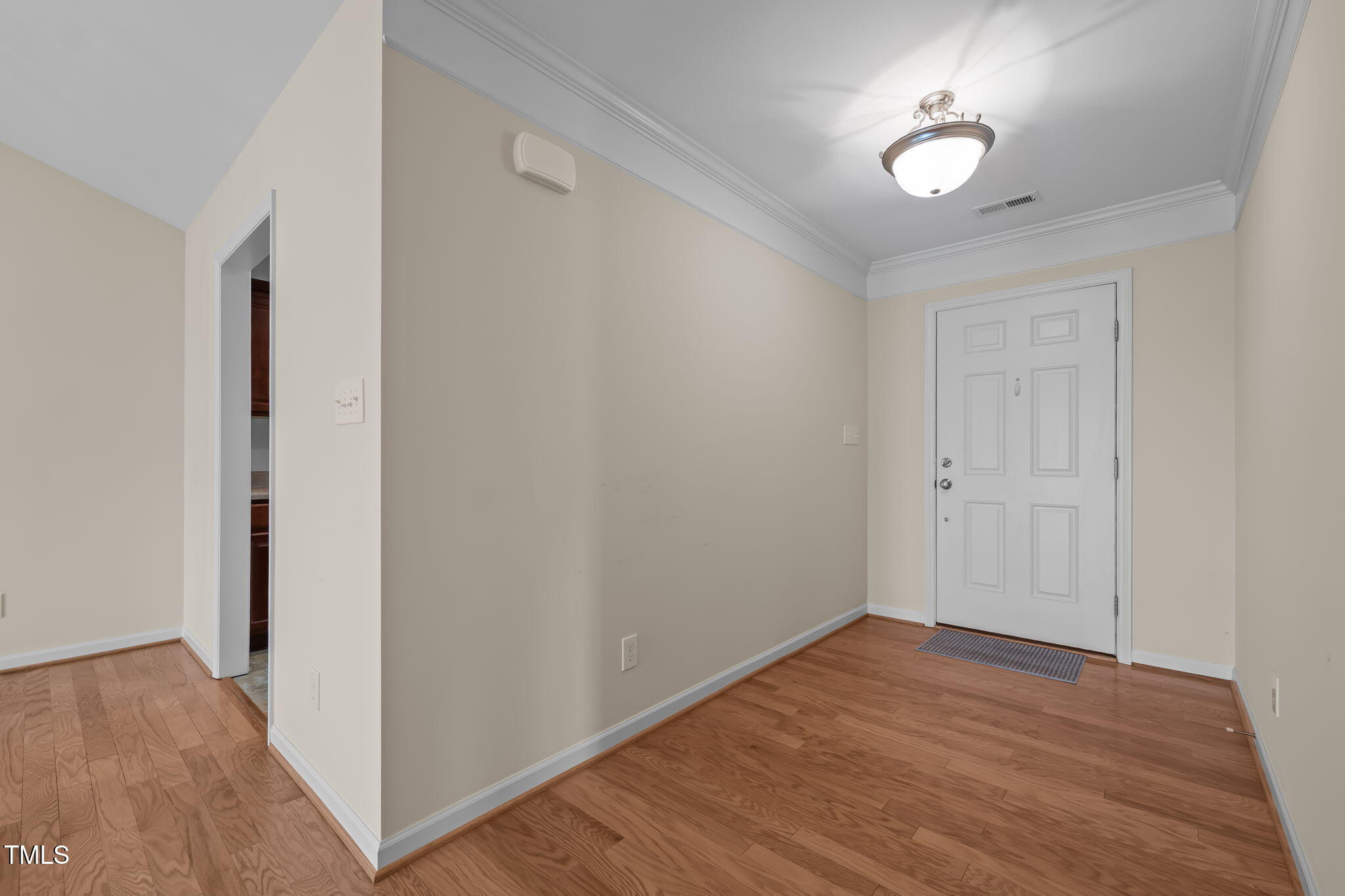 2002 Guinness Drive, Unit 5 Graham, NC 27253 - Photo 2 of 30 a view of empty room with wooden floor