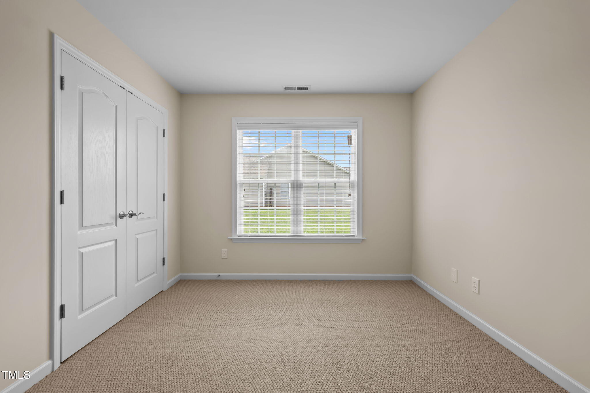 2002 Guinness Drive, Unit 5 Graham, NC 27253 - Photo 21 of 30 an empty room with a window