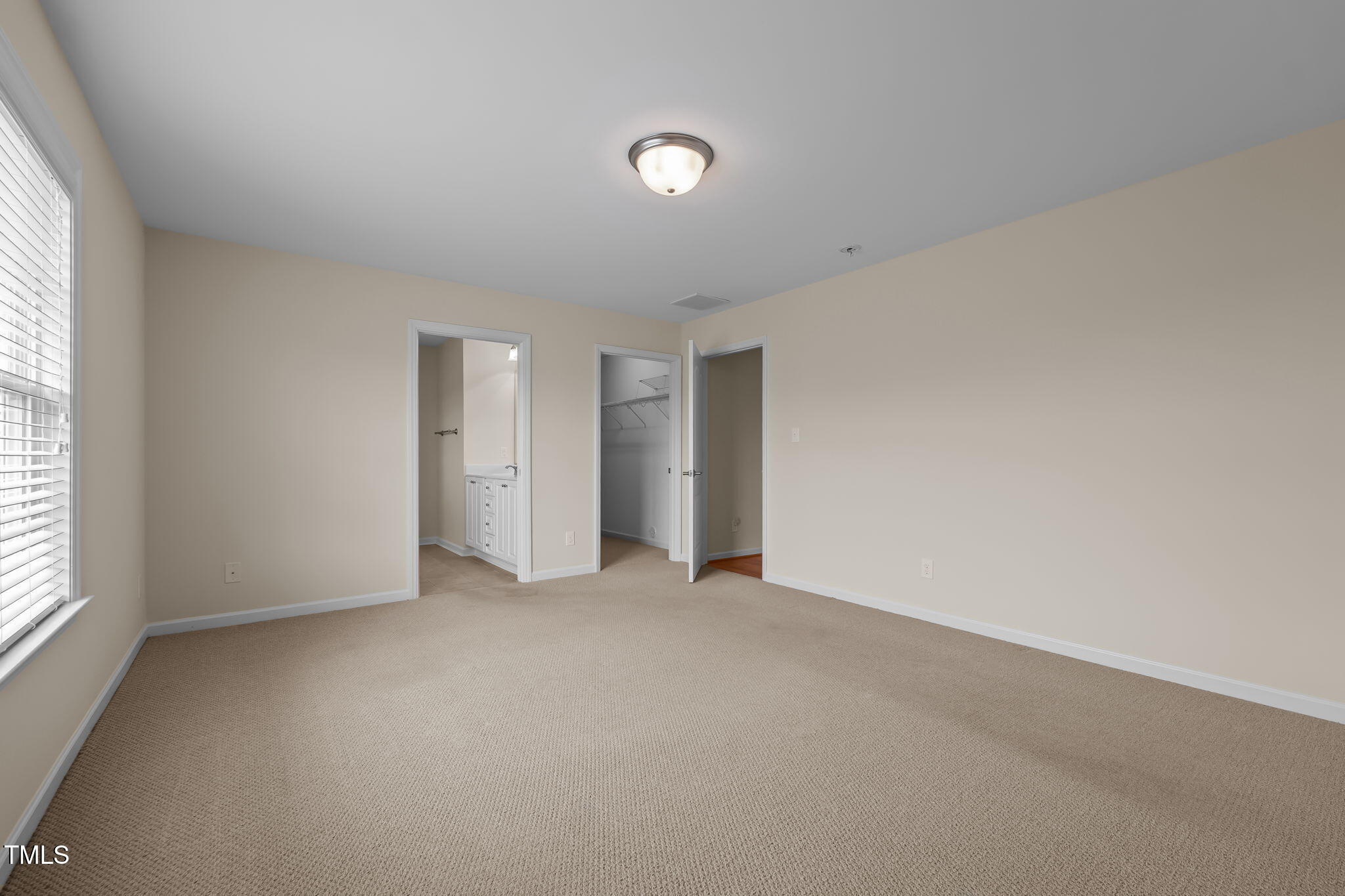 2002 Guinness Drive, Unit 5 Graham, NC 27253 - Photo 25 of 30 an empty room with windows and closet