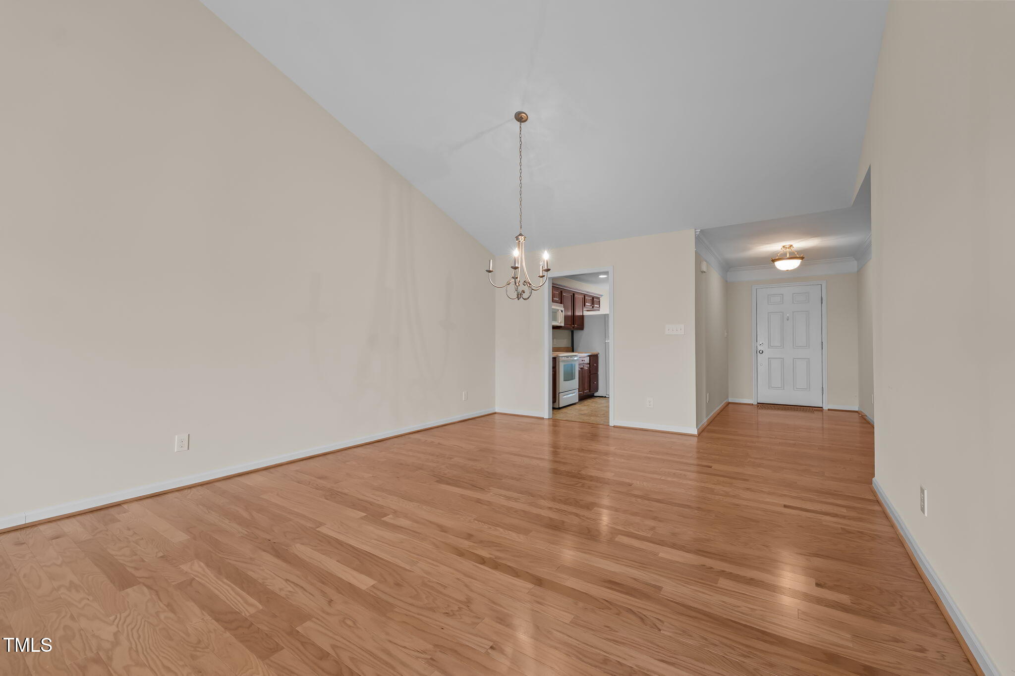 2002 Guinness Drive, Unit 5 Graham, NC 27253 - Photo 6 of 30 a view of an empty room with a kitchen