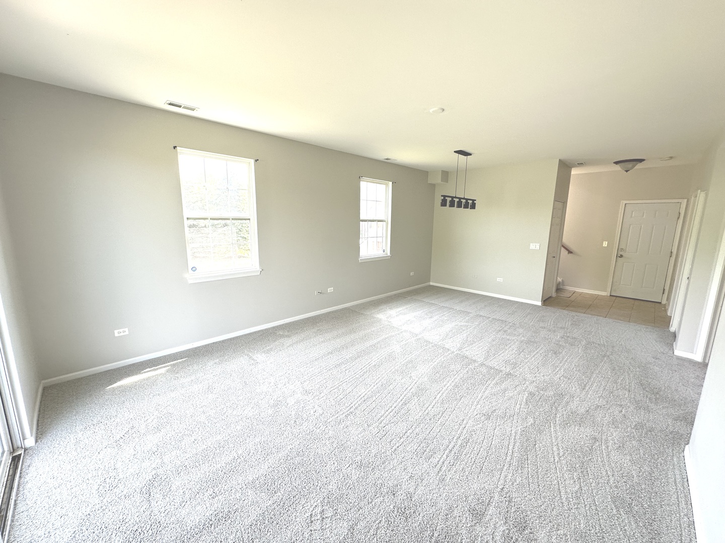 5900 Dublin Court, Unit 5900 McHenry, IL 60050 - Photo 11 of 14 an empty room with windows