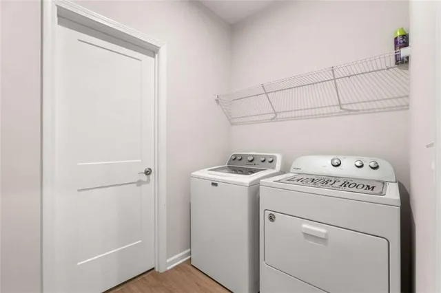 a kitchen with stainless steel appliances kitchen island wooden cabinets and granite counter tops