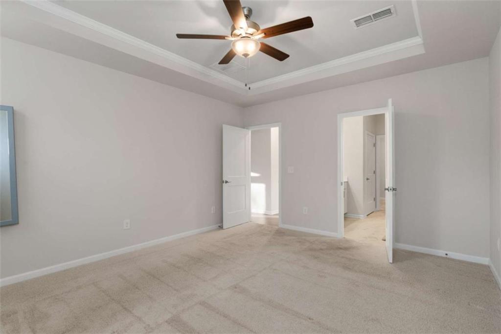 15 Parkside View Cartersville, GA 30121 - Photo 23 of 43 an empty room with closet and a ceiling fan