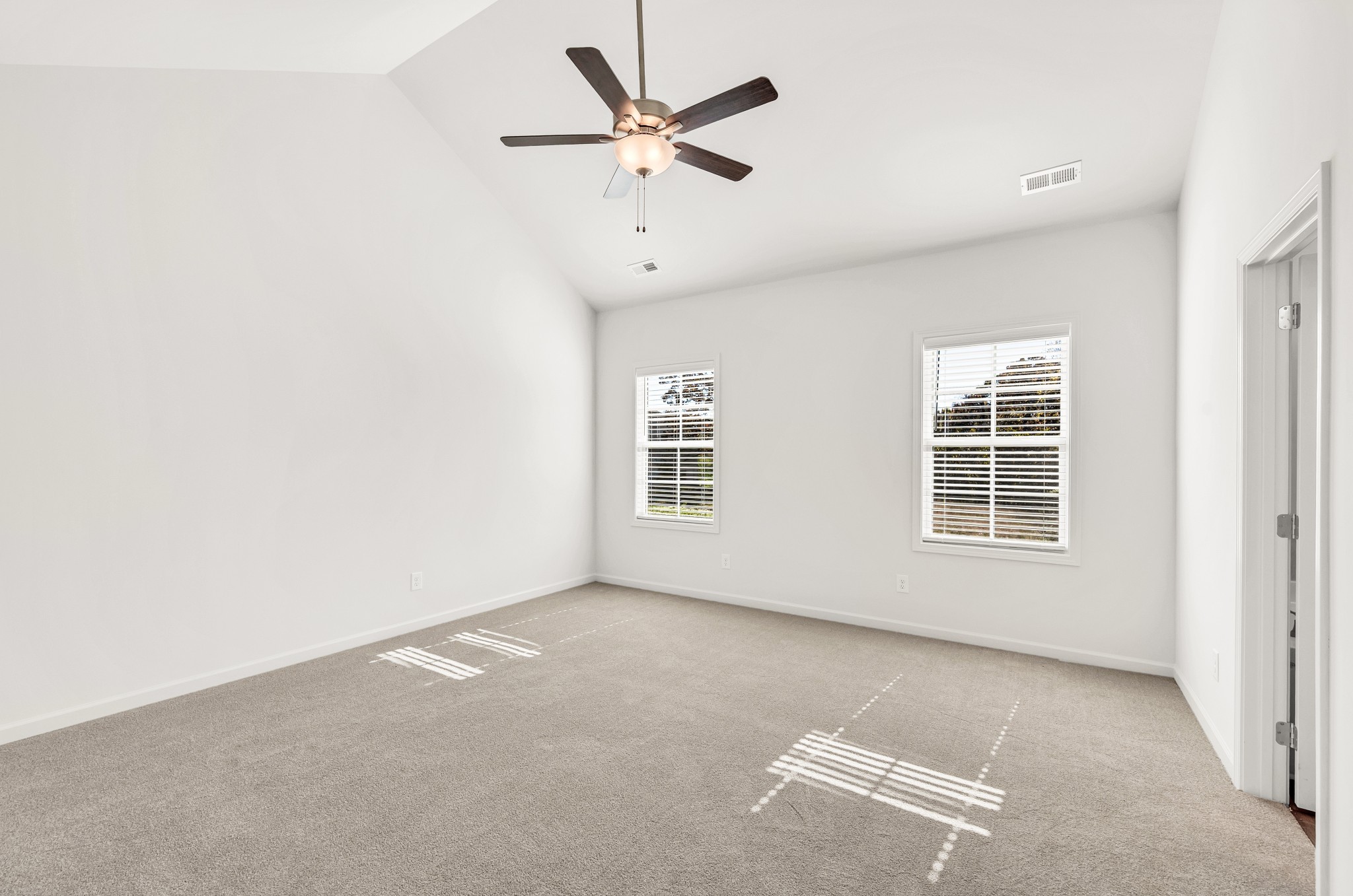 7103 Wiley Circle Fairview, TN 37062 - Photo 16 of 33 an empty room with a window and a ceiling fan