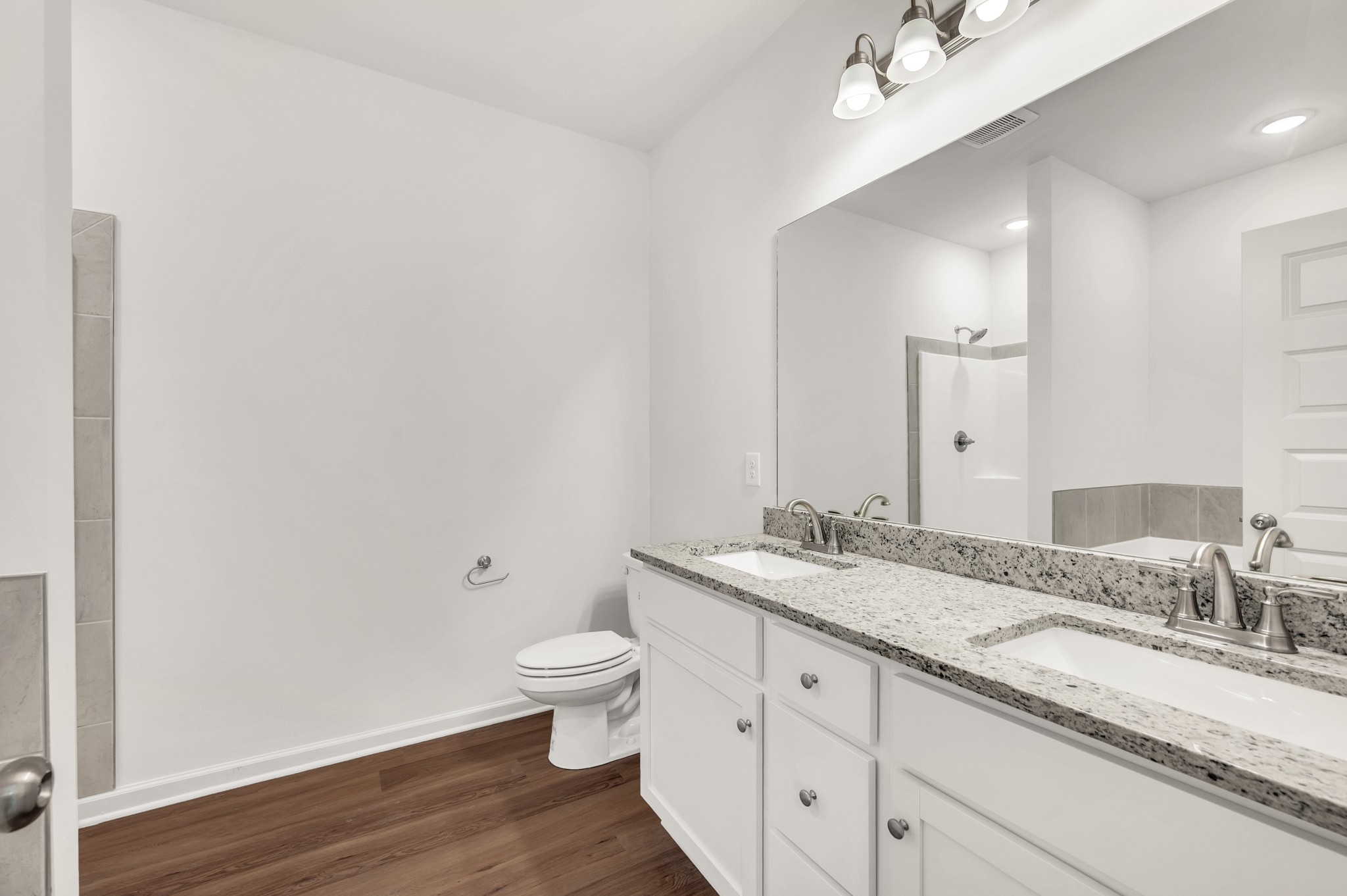 7103 Wiley Circle Fairview, TN 37062 - Photo 19 of 33 a bathroom with a granite countertop sink and a mirror