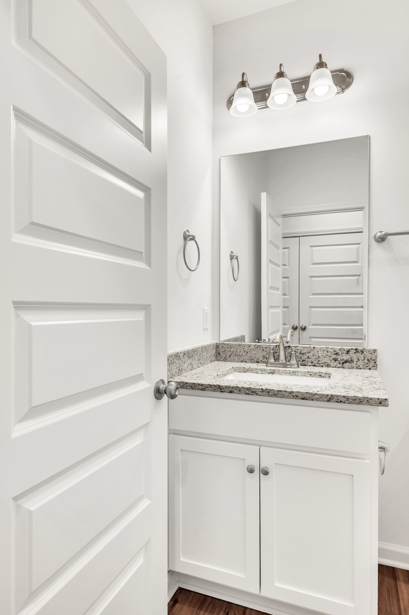 7103 Wiley Circle Fairview, TN 37062 - Photo 27 of 33 a bathroom with a granite countertop sink and a mirror