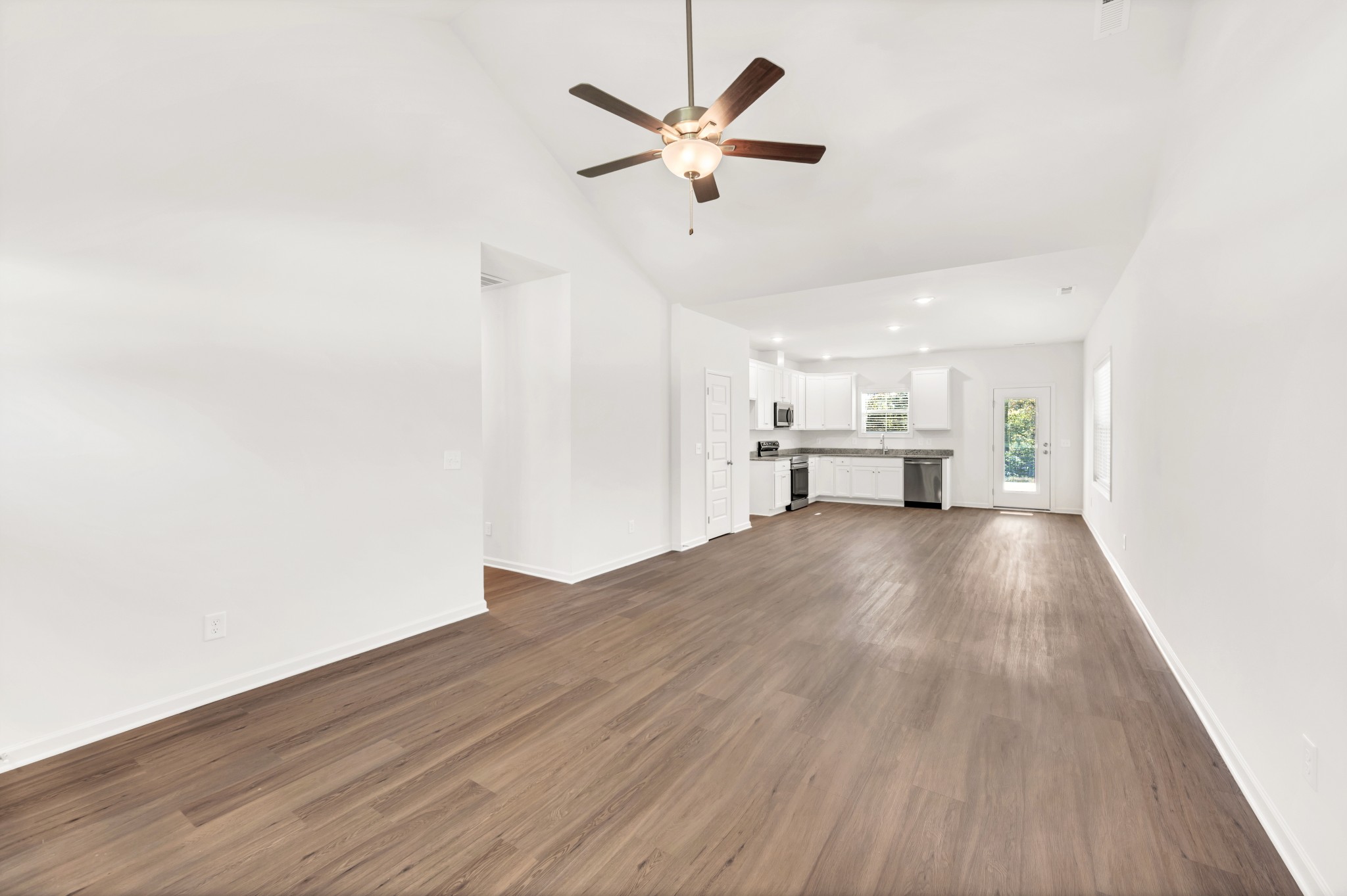 7103 Wiley Circle Fairview, TN 37062 - Photo 6 of 33 a view of empty room with wooden floor and ceiling fan