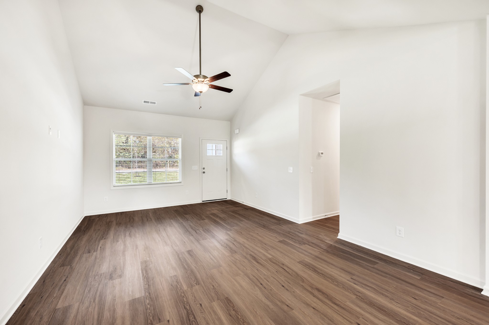 7103 Wiley Circle Fairview, TN 37062 - Photo 7 of 33 a view of an empty room with wooden floor and a window