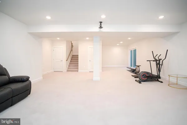 a view of a livingroom with workspace and a couch