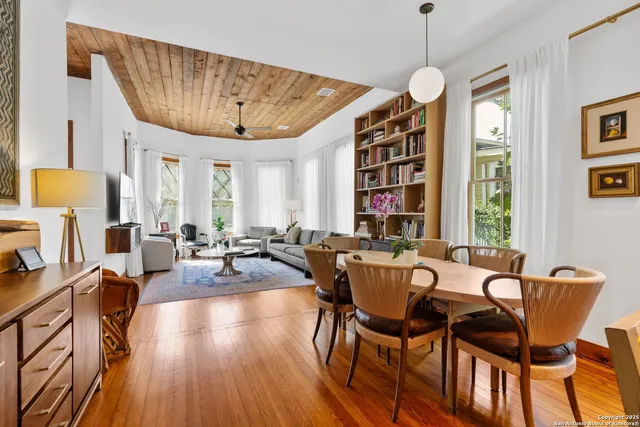 a view of a dining room with furniture window and wooden floor