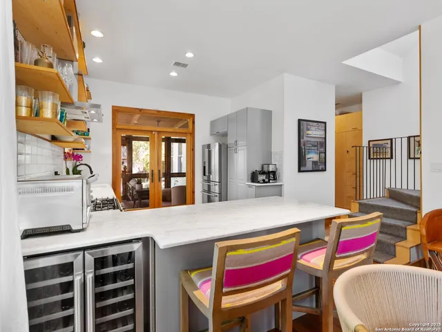 a room with a bed and a table in it