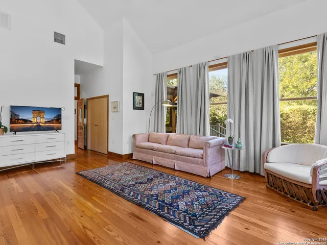 a living room with furniture and a rug
