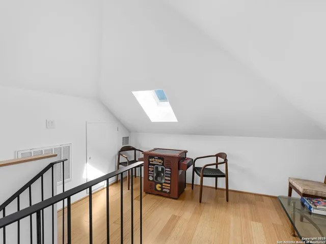 a view of a livingroom with furniture and wooden floor