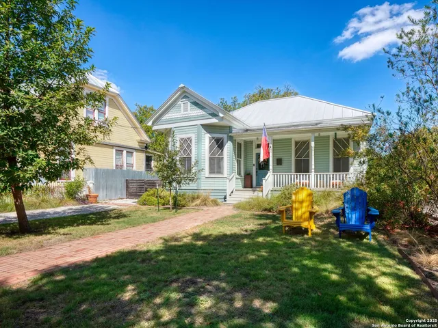 a front view of a house with table and chairs