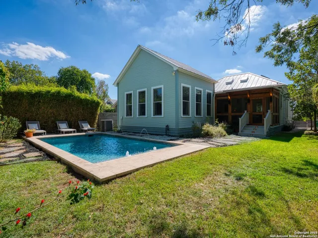 a front view of house with yard and outdoor seating