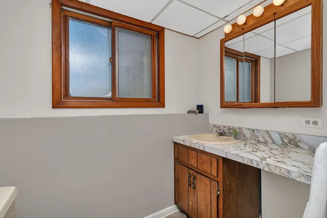 a bathroom with a sink and a mirror