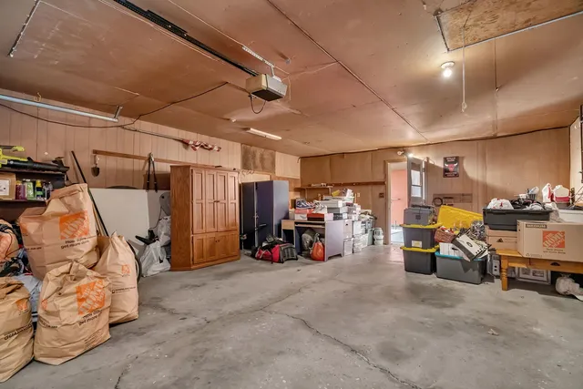 a view of a garage with a bike and car