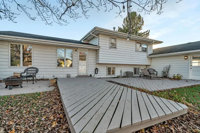 a view of a backyard with sitting area