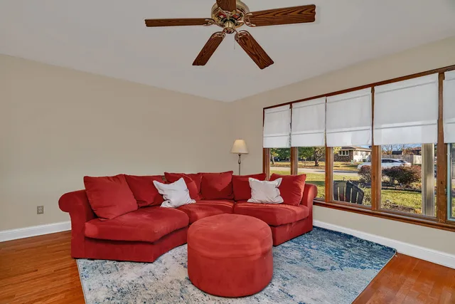 a living room with furniture and a rug