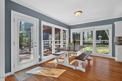 a living room with couch and wooden floor