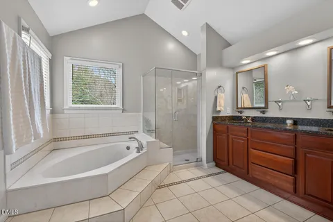 a bath tub sitting in a bathroom next to a window