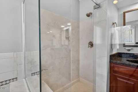 a spacious bathroom with a bathtub and a shower