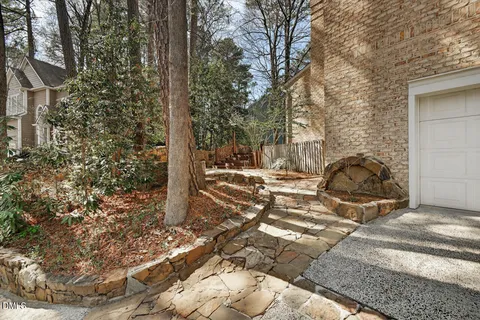 a view of a patio with table and chairs and wooden floor
