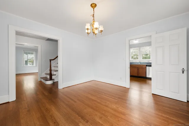 a kitchen with stainless steel appliances granite countertop a stove a sink dishwasher and a refrigerator