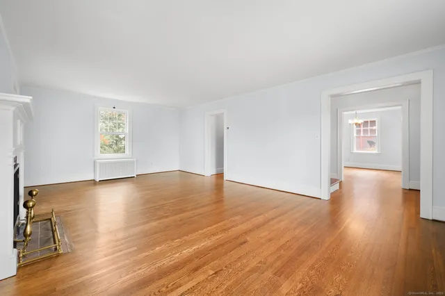 a view of entryway with wooden floor and stairs
