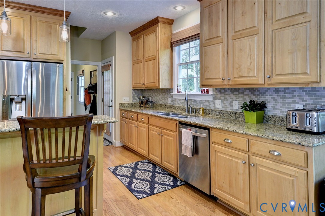 4015 Cold Spring Road Williamsburg, VA 23188 - Photo 17 of 57 Kitchen featuring light wood cabinetry and granite