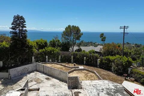 a view of a swimming pool with a yard